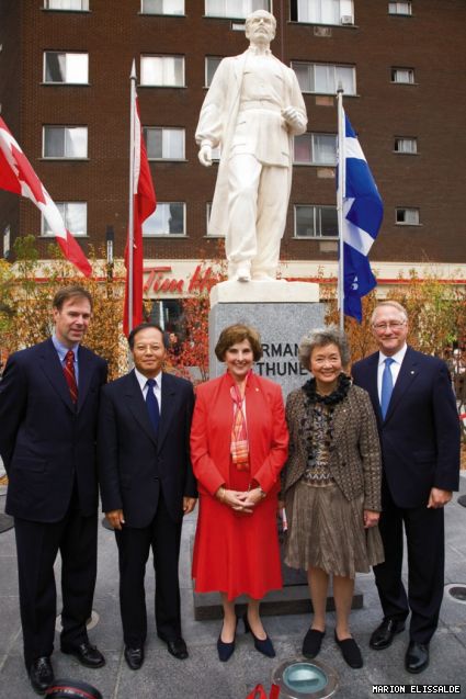Board Chair Peter Kruyt, Chinese Ambassador Lan Lijun, President Judith Woodsworth, former governor-general Adrienne Clarkson and Montreal Mayor Gérald Tremblay pose with the refurbished Bethune statue.